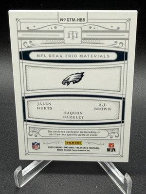 2025 National Treasures Jalen Hurts AJ Brown Saquon Barkley NFL Gear Trio /25